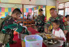 Sukseskan Program MBG, Satgas Yonif 144/JY Gelar Makan Siang Bersama Murid SD Kp. Assiki Boven Digoel